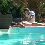 Massage in the swimming pool in the private villa in Tauro